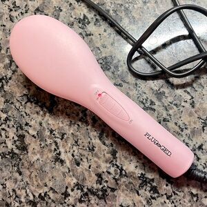 Plugged In pink hair straightener brush